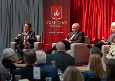 Carthage president John Swallow, right, speaks during ?The Future of Education,? an April 18 even...